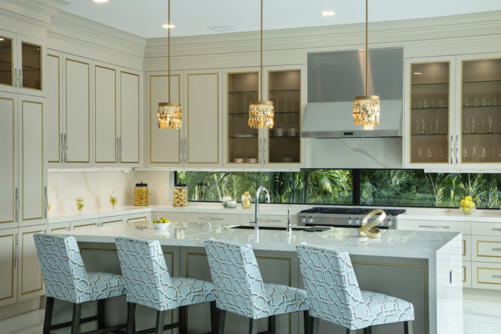 Kitchen with under-cabinet lights, three pendants and recessed lighting