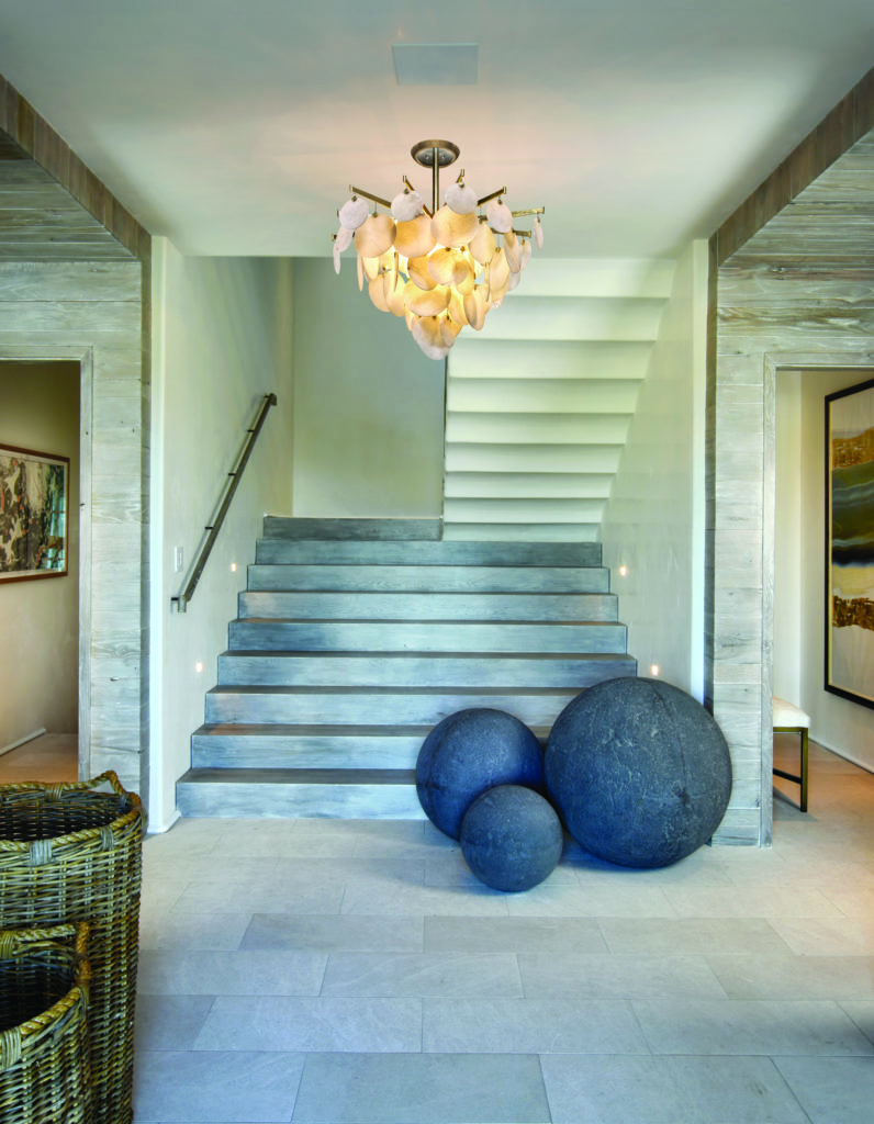 Bright-and-airy foyer lighting ideas include this nature-inspired Serenity 40 Inch LED Large Pendant by Corbett Lighting