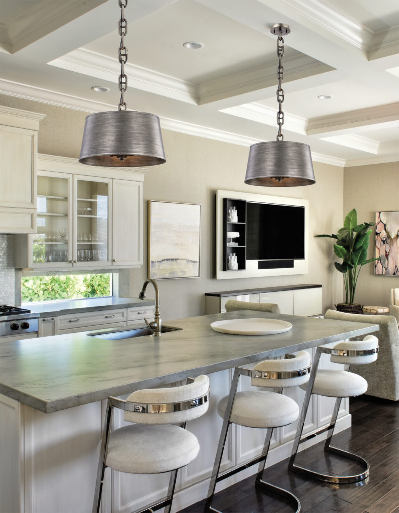 The kitchen island lighting guide explains why the Admirals Row steel finish works in this white kitchen
