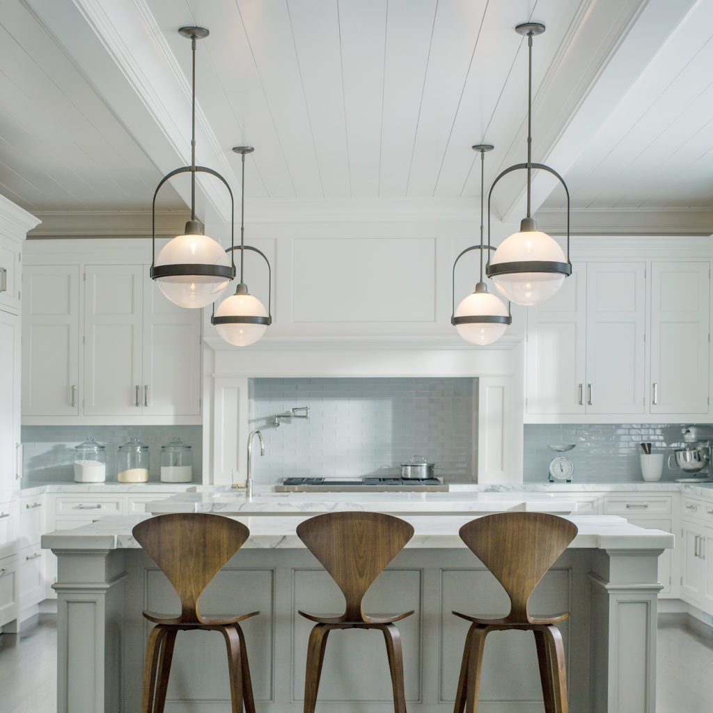 The Atlas by Hubbardton Forge has a unique arch design that infuses personality in an otherwise monotone kitchen