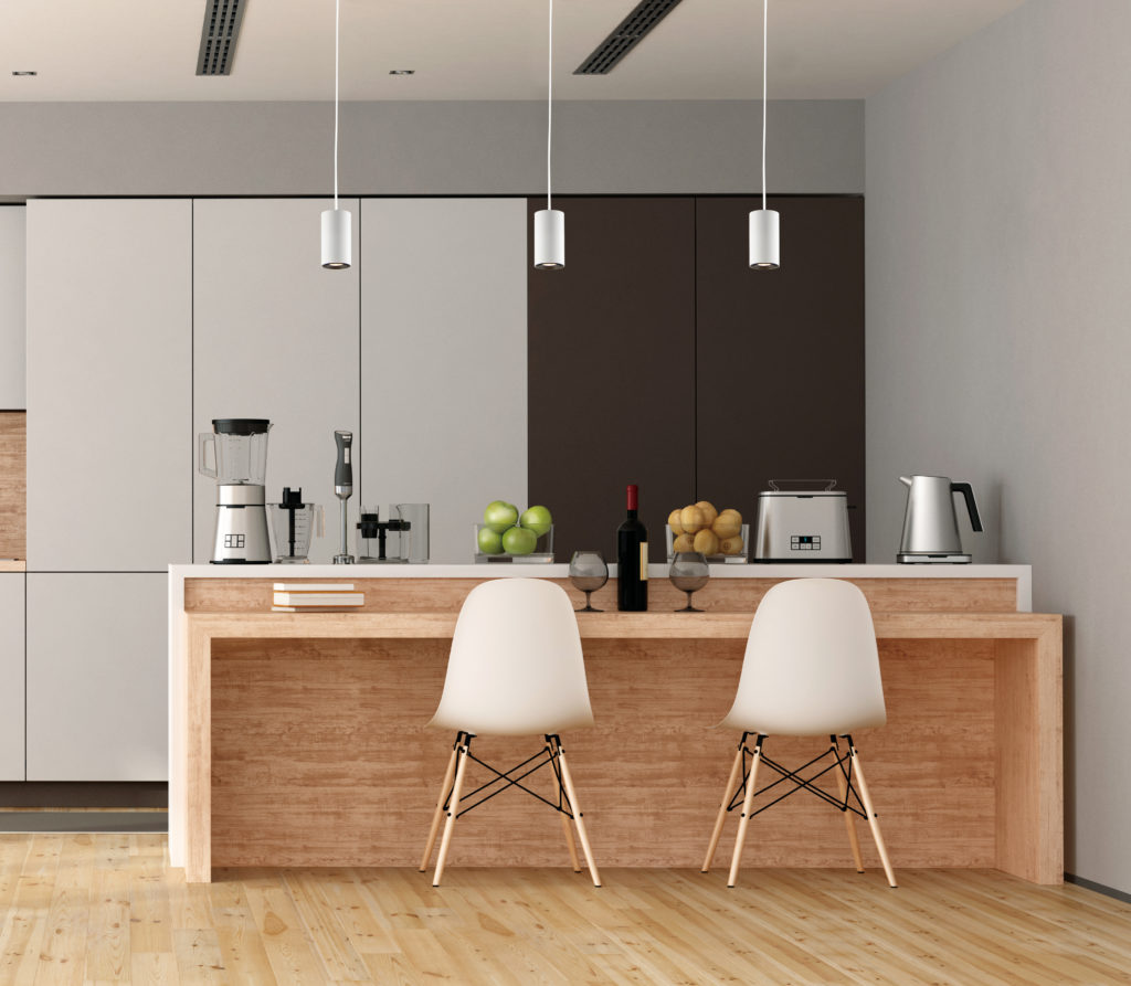 The slender Dwell Mini Pendant by ET2 Lighting complements a minimalist kitchen 