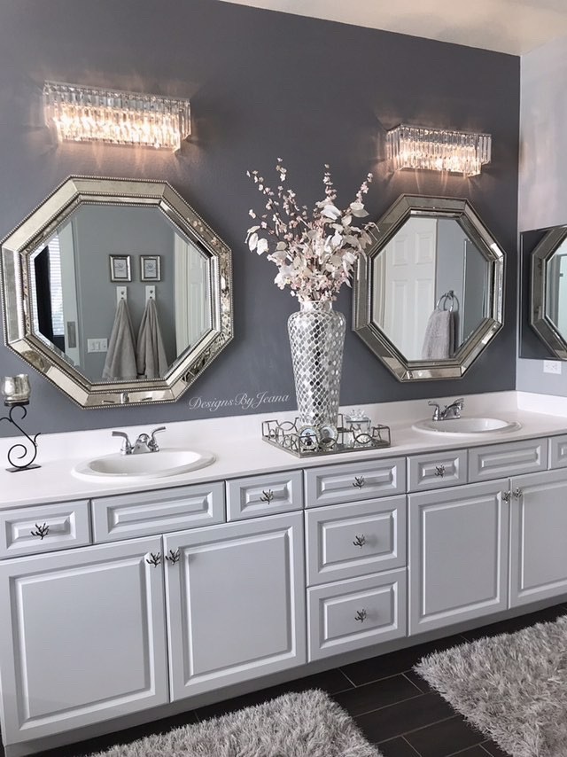 Add the Palacial 21 Inch crystal-lined luxury lighting over simple white cabinets to upgrade your bathroom