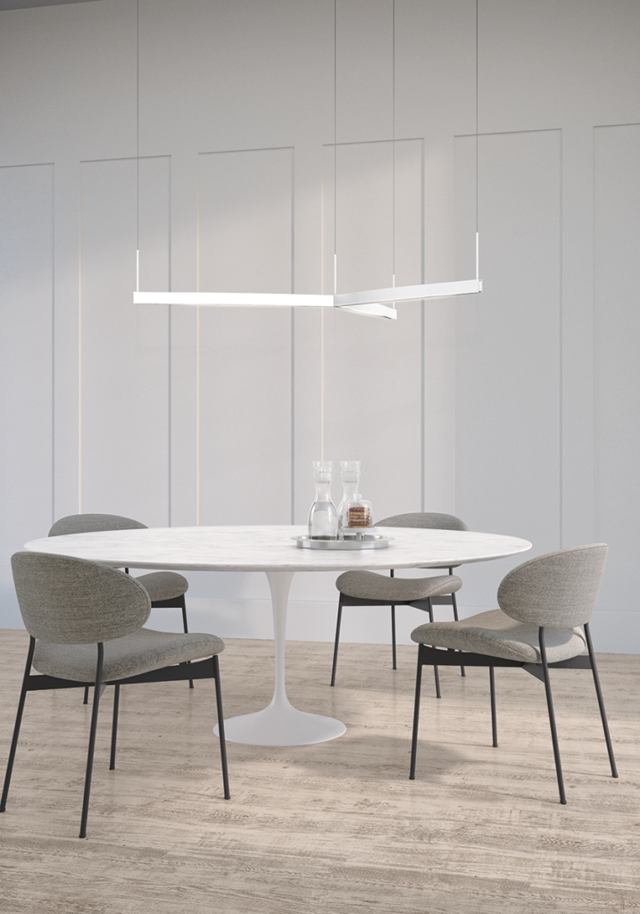 The linear Ola Pendant by Sonneman is a beautiful contrast hanging over a perfectly round table.