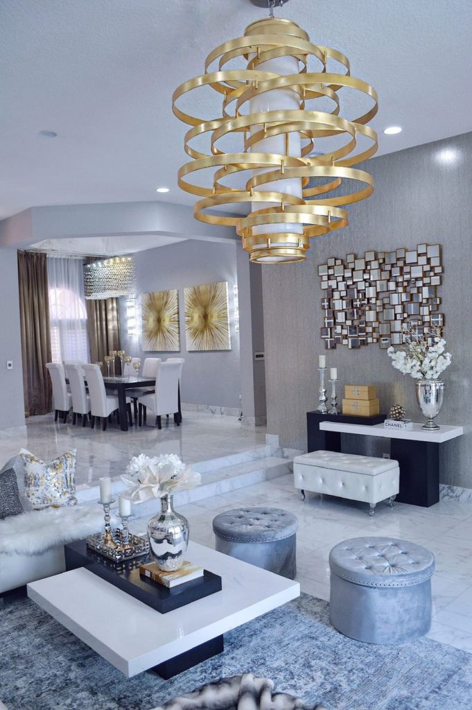 A gold leaf finish makes this oversized pendant instantly feel like luxury lighting in a mixed-metals living room.  