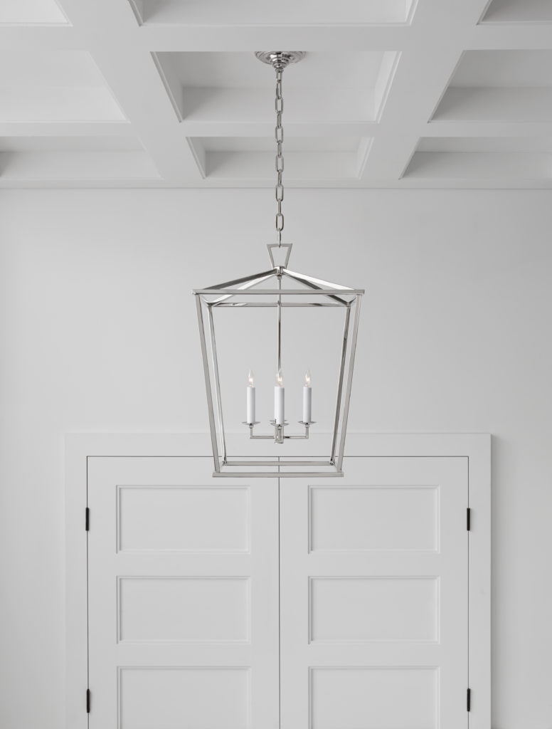 Simple lantern-style cages are popular types of pendant lights in sleek-white modern homes
