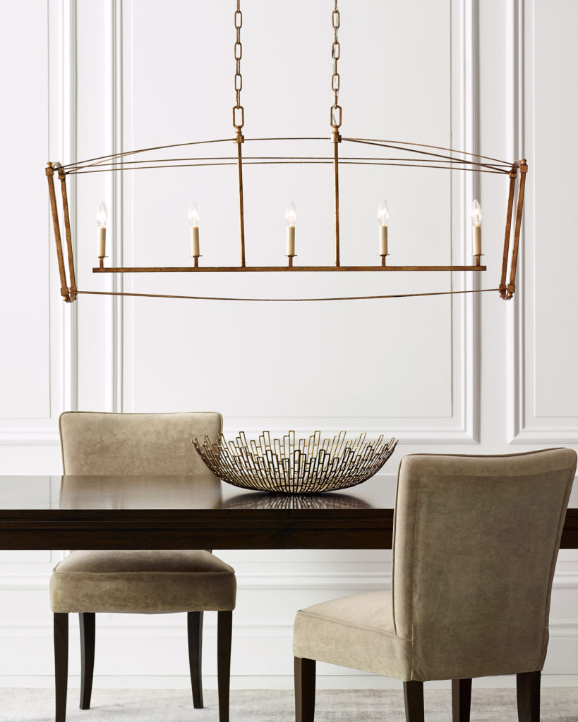 In antique guild, the Feiss Thayer Linear Light coordinates with the long, dark wood table