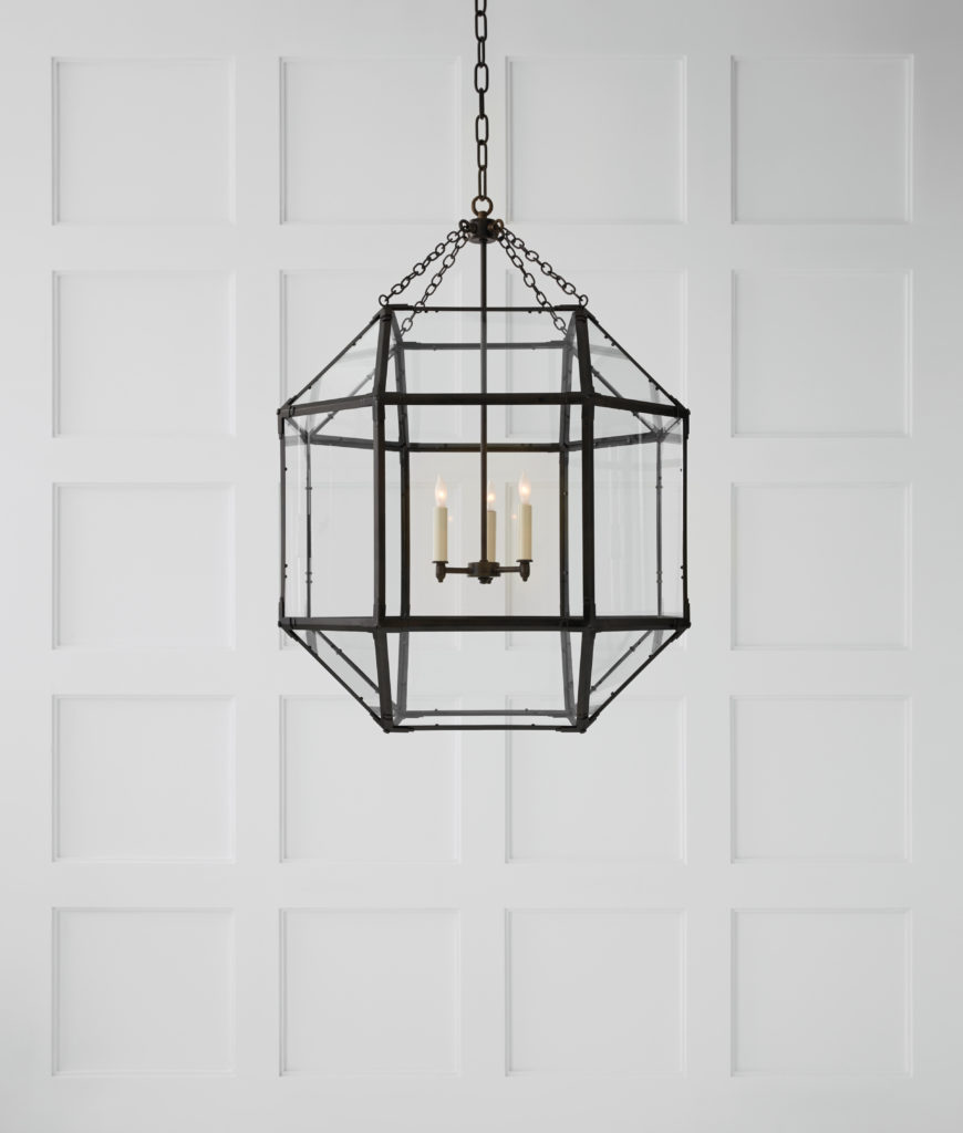 The Suzanne Kasley Morris Cage by Visual Comfort has glass panes that give it a heart structure.