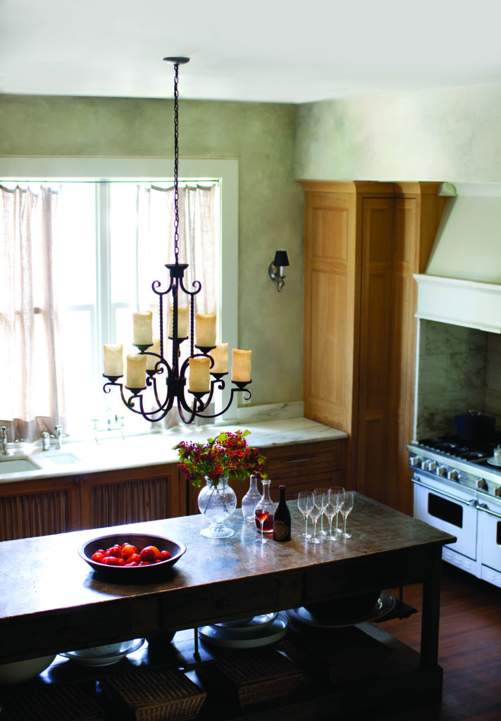 Casa 29 Inch Chandelier looks charming in a rustic-style kitchen with a long, wood island 