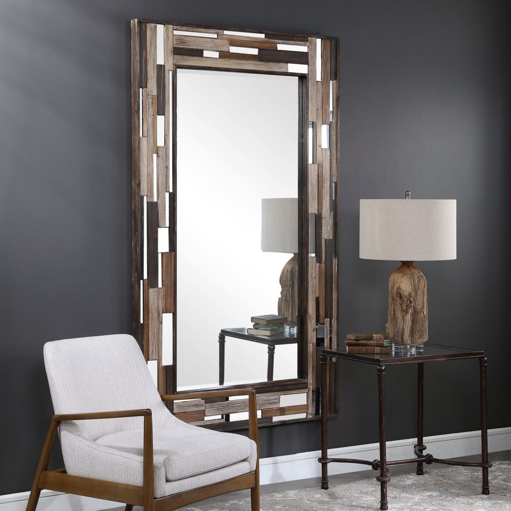 Long, rectangular Zevon Mirror hangs on slate-gray wall to make a room look bigger