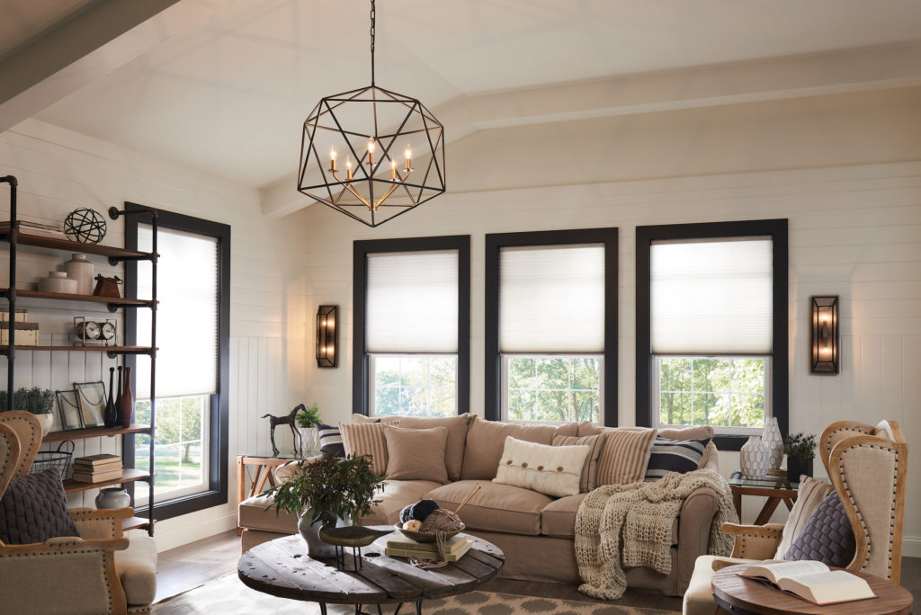 The geometric Astrid Chandelier by Hinkley lights up a transitional-style living space | Capitol Lighting