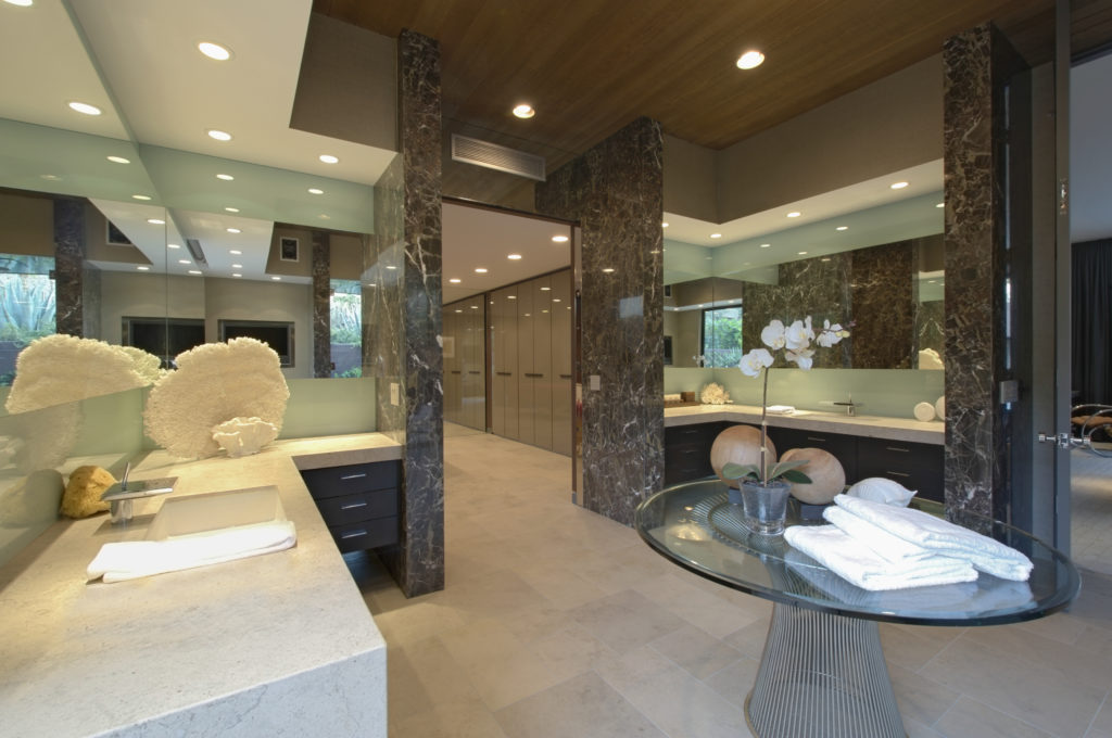 Cove recessed lighting brightens a sleek, contemporary bathroom vanity | Capitol Lighting
