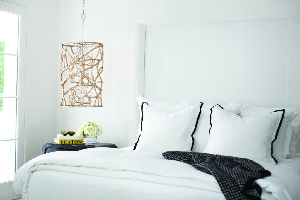 Eve Cage pendant by Frederick Ramond hangs in modern bedroom like a dramatic piece of art | Capitol Lighting
