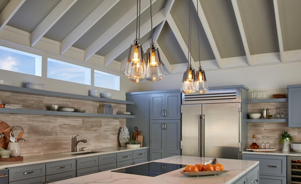 Feiss Waveform Pendant is unique kitchen lighting clustered in threes over coastal-blue cabinets. 