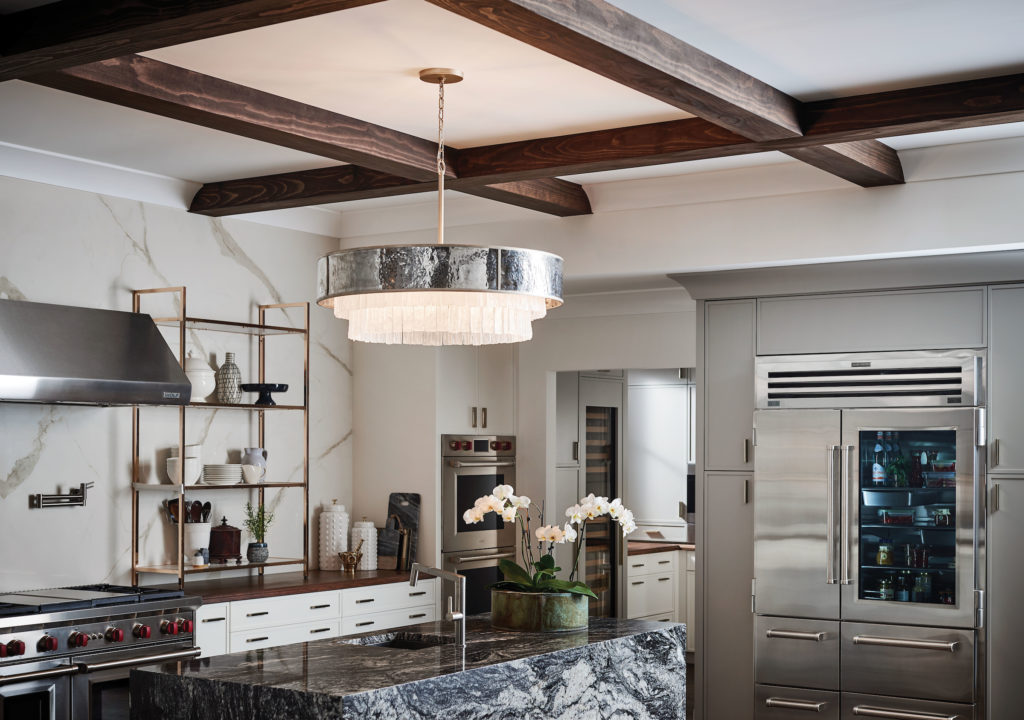 The transitional-style Reverie Chandelier provides enough light, hanging in the center. 