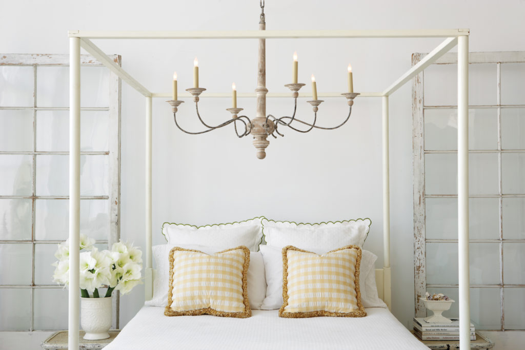 Studio Vc Country Chandelier hangs in the center of a four-poster bed to set the mood Capitol Lighting