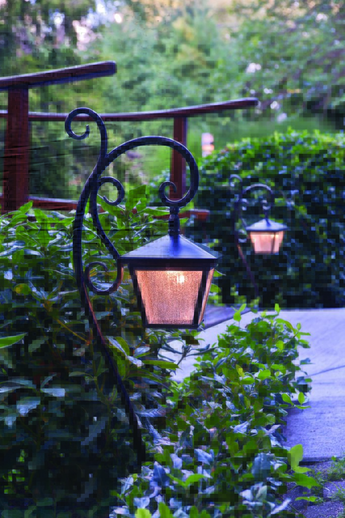 Trellis Pathway Light adds personality to a backyard, especially next to a walking bridge. 