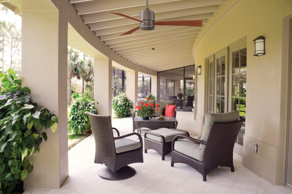 The contemporary-style Zonix outdoor ceiling fan blends in with modern wrap-around patio.