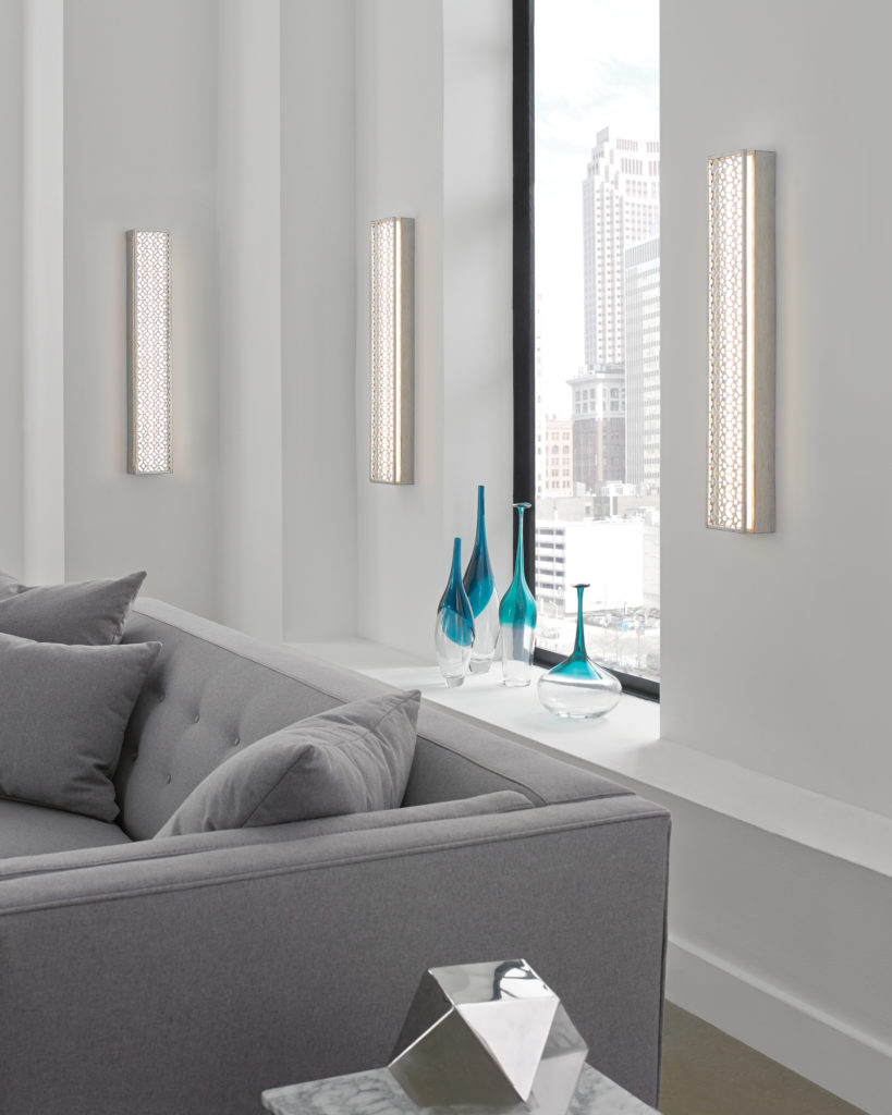 The Feiss Kenney wall sconce sends LED light directly into this contemporary living room.