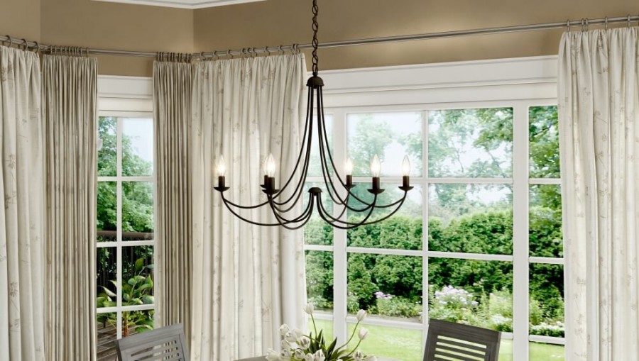 Mirren chandelier is a lightweight lighting design that balances a thick, round dining table. 
