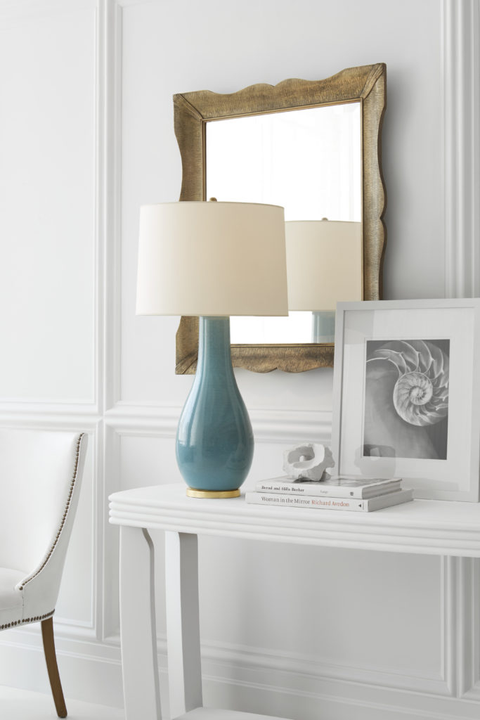 With its bright blue base, the Orson table lamp adds a pop of color to any living room design. 