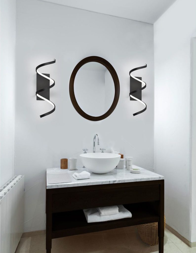 Synergy wall sconce combines modern lighting function and form to light your bathroom vanity. 