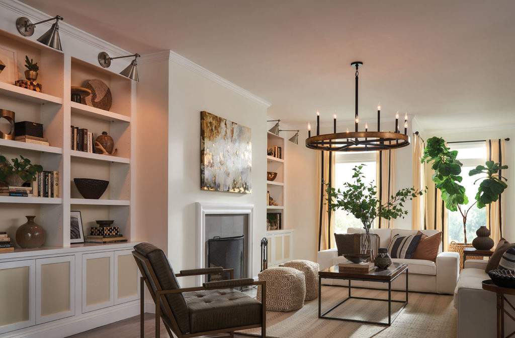 Create warm living room lighting with the big brass Wells chandelier in a modern setting.