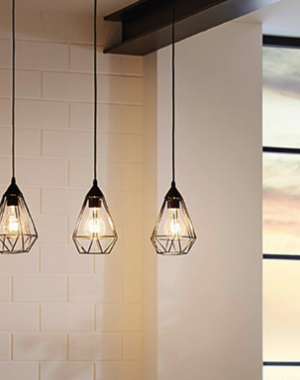 Trendy pendant lighting fixtures near kitchen window