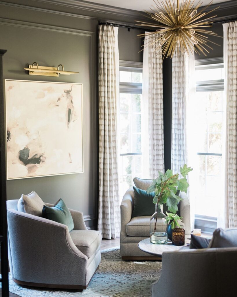 Nicely decorated room with a golden wall sconce.